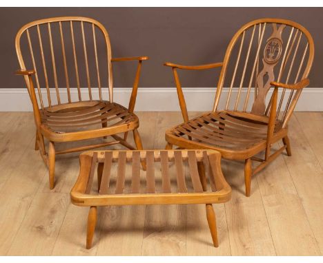 Two 1960s Ercol hoop-back open armchairs with cushions seats; together with a stoolthe largest armchair 71cm wide x 75cm high