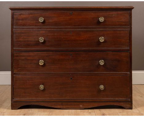 A Georgian mahogany mule chest of drawers with a frieze of two dummy drawers above two long drawers, with a hinged top, on br