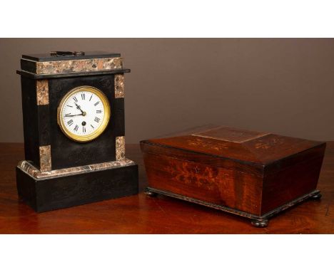 A slate mantel clock with marble mounts and incised scrollwork decoration; together with a rosewood tea caddy of sarcophagus 