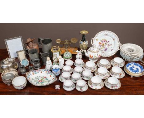 A Dresden tea service with seven cups and saucers, two sugar bowls, a milk jug, a teapot and a serving platter; a brass carri