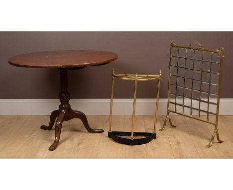 A collection of furniture to include a tilt-top circular tripod table raised on cabriole legs; a brass framed fire screen wit