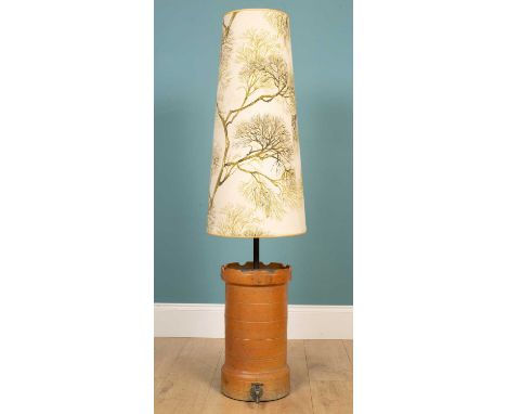 A decorative table lamp, constructed from a Victorian salt-glazed water filter, in the form of a turret with a castellated to