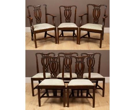 A set of eight Chippendale style mahogany dining chairs, each with a shaped top above a pierced splat, the drop-in seats rece