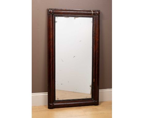 A William IV rectangular wall mirror set with half-round pilasters and reeded ebonised slip around the old mirror plate67cm w