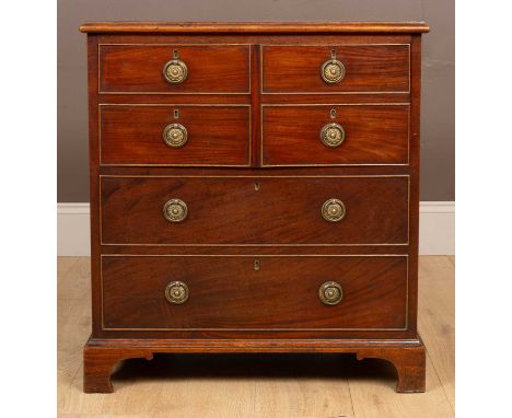 A George III mahogany commode styled as a chest of drawers, with an arrangement of six drawers69cm wide x 48cm deep x 77cm hi