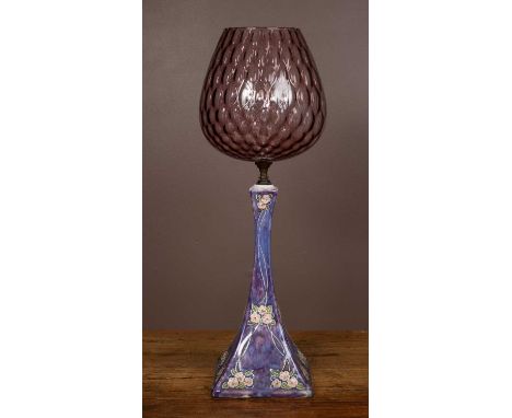 A late 19th century Royal Doulton stoneware lamp base decorated with flowers, of spreading sure section form, stamped beneath