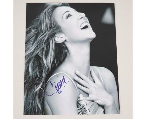 Original promotional photograph of international recording artist Celine Dion, featuring a striking black and white portrait 