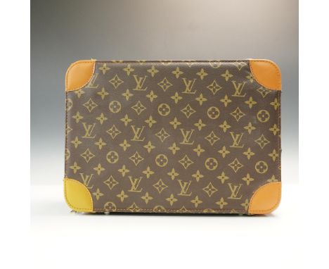 Louis Vuitton monogram canvas vanity case featuring the iconic LV monogram pattern on brown coated canvas with natural leathe