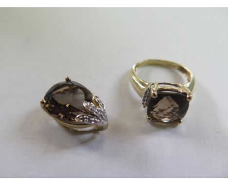 A 9ct yellow gold smokey quartz ring, size K - stone size 10mm x 10mm, and a matching pendant, 16mm long - total weight appro