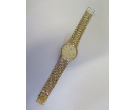 A gentlemen’s Longines Quartz Presence 9ct gold with calendar to dial and raised batons, the case and its woven strap are bot