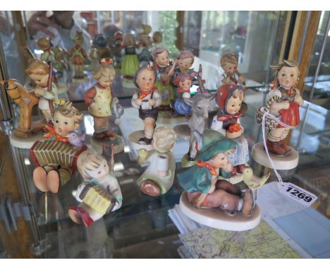 12 Hummel figurines, largest approximately 12cm, all in good condition 