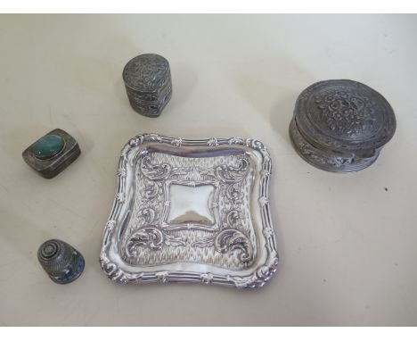 A mixed silver lot, three pill boxes, one with green stone, two with embossed decoration, embossed pin dish, Russian enamel t