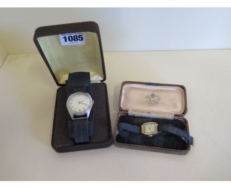 A 9ct gold ladies watch, running, and a gents manual wind steel presentation watch - 33mm wide including winder, running 