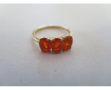 A 9ct three stone tangerine opal ring, size P/Q, approx 2.2 grams - good condition 