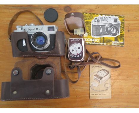 A retro, Soviet union era, Zorki 4K camera with original case, Soviet Union issue with name in Cyrillic, also a Horvex 3 mete