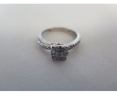 A 9ct white diamond cluster ring, approx 020ct, ring size K, approx 2.6 grams, good condition 