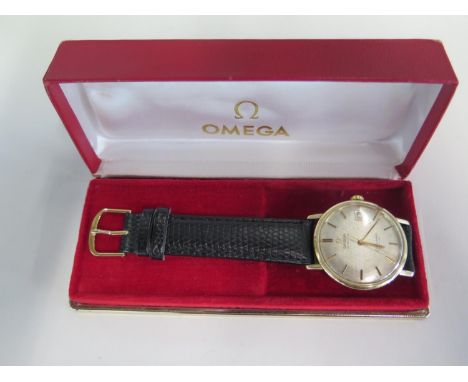 An Omega Seamaster De-Ville solid gold bezel with gold hooded lugs and steel case - Automatic Omega movement - case opens thr