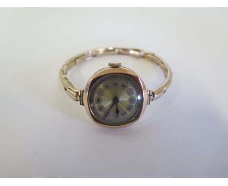 A 9ct gold lady’s wristwatch and case, with Roman numeral dial, 2.5cm wide including button, approximately 18.5g overall, wit