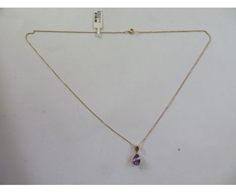 A 9ct gold amethyst and diamond pendant necklace, pendant 17mm long - approx 1.7 grams - ex jewellers stock, new condition 
