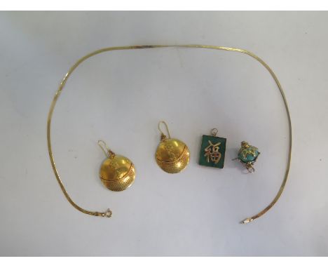 A Chinese jade pendant in a 14ct mount on a 14ct chain - 45cm long, chain weight approx 3.4 grams, a gilt metal pendant and a