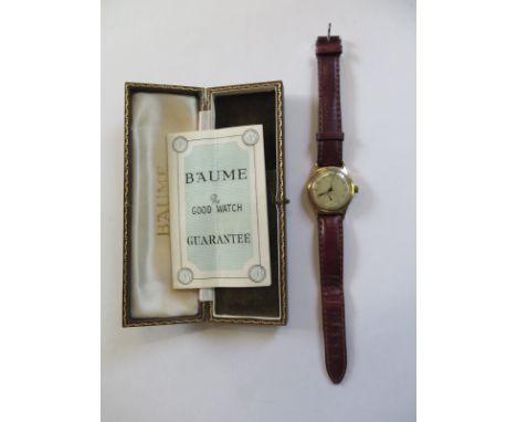 A Baume 9ct yellow gold presentation wristwatch, manual wind, 32mm wide, some spotting to dial with box and guarantee, runnin