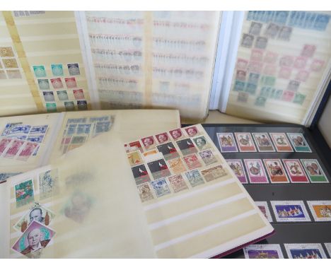 Eight stamp albums of different sizes with British and international stamps, also some first-aid covers, please see images 