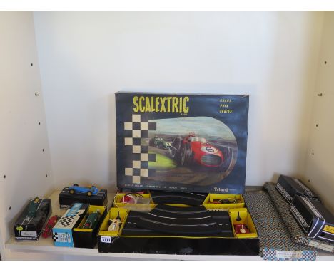 A Scalextric Grand Prix Series set with two additional cars - Vanwall MM/C53 and C051 BRMP160 and parts 