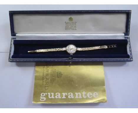 A Vintage 9ct yellow gold Garrard ladies bracelet wristwatch, 21mm wide including button - 16cm long, in clean working condit