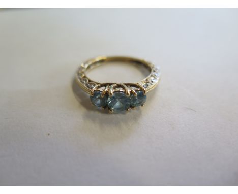 A zircon and diamond ring, the graduated three zircons to the single cut diamond three-quarter band stamped 14 K, ring size P