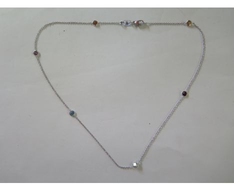 A modern 18ct hallmarked white gold trace linked necklet interspersed with six various round mixed cut coloured gemstones, ci