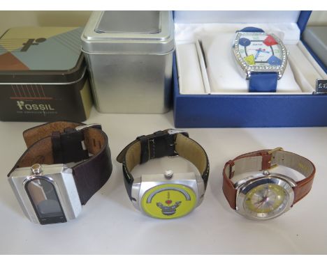 Four Gentlemans wristwatches, a retro style Fossil with digital LCD seconds counter and leather strap, a Motion spinning disc