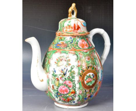 A 19th Century Chinese Cantonese Canton Region porcelain teapot of ovoid shape having a bell finial lid with bamboo affect ha