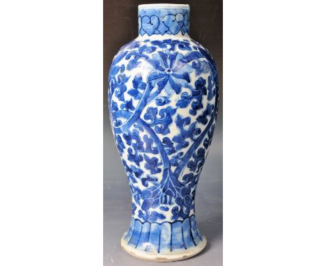 A 19th Century Chinese Oriental Kangxi marked blue and white vase of baluster form. Hand painted scrolling leaves pattern &am