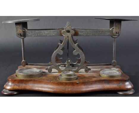 A 19th Century Victorian walnut and brass set of postal / parcels scales &amp; weights. The scales featuring two foliate scro