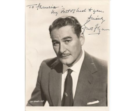 Errol Flynn signed 10 x 8 b/w portrait photo. Nice image in check jacket, shirt and tie. Signed in black dedicated to Francis