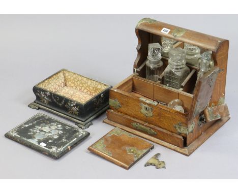 A Victorian oak tantalus with plated mounts &amp; fitted three glass decanters, 35cm wide; &amp; a Victorian mother-of-pearl 
