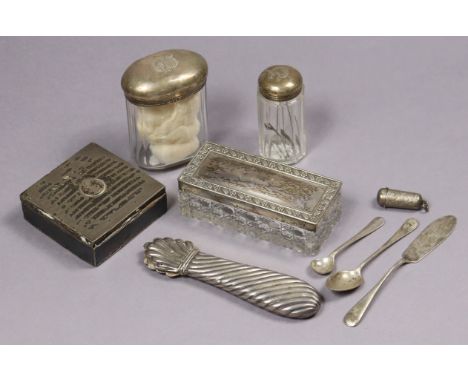 A silver square trinket box; three cut-glass receptacles each with a silver cover; two silver spoons, etc.