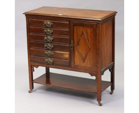 An Edwardian mahogany music cabinet fitted six long drawers to the left-hand side with hinged fronts, with cupboard to the ri