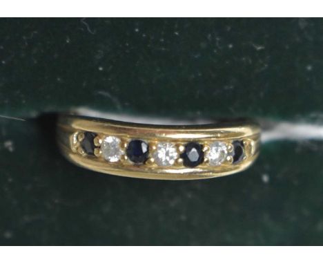 A sapphire and diamond ring, the four circular facet-cut sapphires parted by brilliant cut diamonds, 9ct yellow gold shank, r