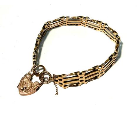 A 9ct yellow gold gate link bracelet, with heart shaped locket, 17.9g gross.