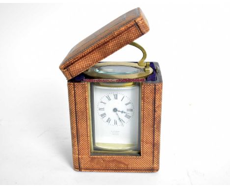 A French brass carriage clock, retailed by R. Stewart, Glasgow, with white enamel Roman dial, platform lever escapement, 15.5