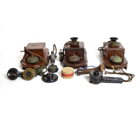 A collection of antique and vintage telephones, including: three walnut cases wall mounted telephones, by Sterling Telephone 