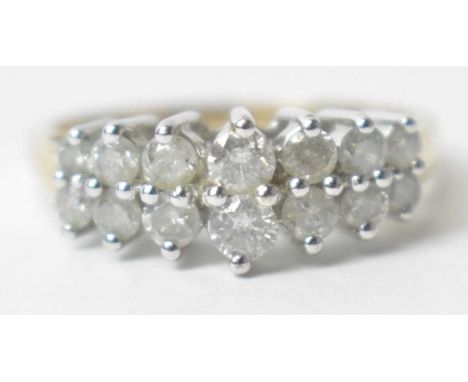 A diamond ring, set with fourteen graduated brilliant cut diamonds, on 9ct gold shank, ring size P, 3.1g gross.
