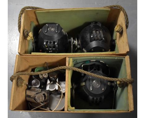 Three industrial spotlights; together with other lighting accessories and equipment, contained across two boxes.