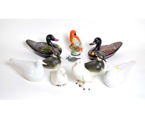 A selection of decorative bird figures, including: two colourfully enamelled lacquered wood egg tureens in the form of ducks,