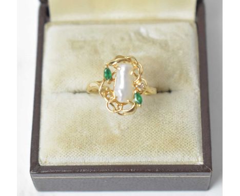 A baroque pearl emerald and diamond ring in 14ct yellow gold nest pattern mound and shank, ring size M, 1.9g gross.