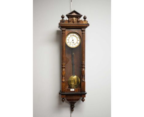 A 19th Century Vienna wall clock, with white enamel Roman dial, in glazed case, 100cms high.
