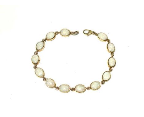 An opal and 9ct yellow gold bracelet, set with thirteen oval opal cabochon links, 8.9g gross.