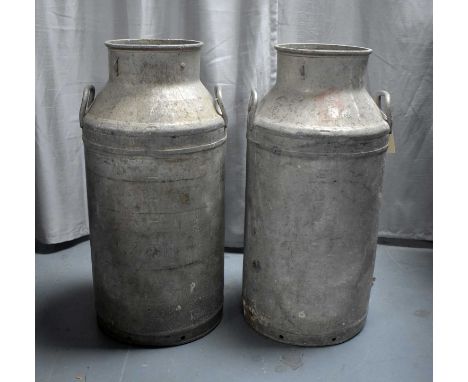 A pair of vintage aluminium milk churns or cans, each 71cms high.