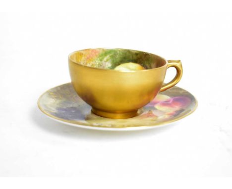A Royal Worcester miniature cup and saucer, hand painted with fruit, signed Ricketts, the saucer 9.5cms diameter.